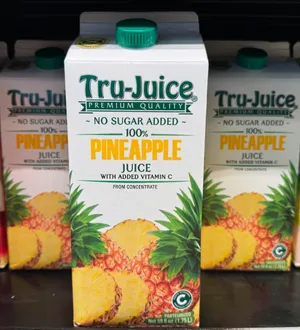 Carton of pineapple juice with added vitamin C and no sugar added.