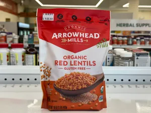 Organic red lentils from the Arrowhead Mills brand in a resealable bag.